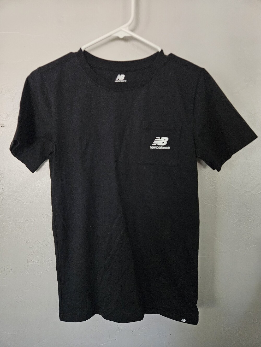 New Balance NWOT Boys XL 18/20 Black Short Sleeve Pocket Tee with White Logo
